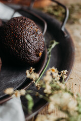 Ripe avocado on an iron plate