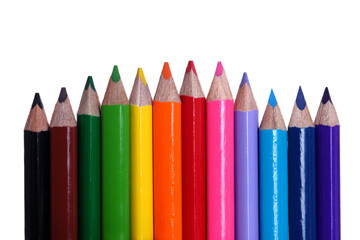 Fototapeta premium line of colored pencils on white background.