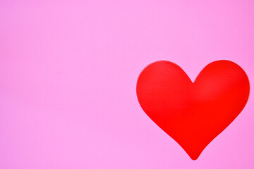 Red heart on a pink background.