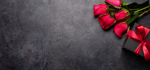 Valentines day greeting card with rose flowers and gift box