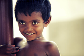 Cheerful funny little boy portrait looking at the camera.