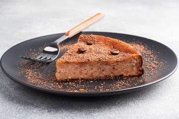 Slice of chocolate curd casserole on a plate, a portion piece of cake with chocolate and coffee.