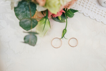 wedding bouquet of roses and rings