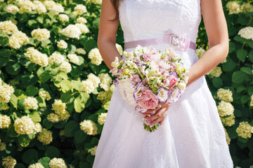 bride and groom holding hands