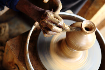 hands of a potter at work