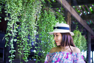 Beautiful and fashionable happy cheerful woman wearing straw hat. Smiling girl in the summer dress is happy life.