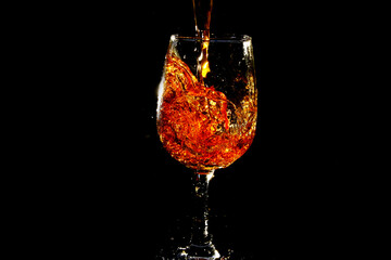 Pouring water into wine glass