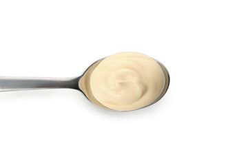 Spoon with mayonnaise sauce isolated on white background