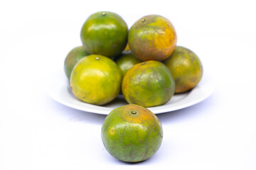 green orange on whtie dish
