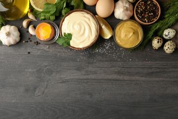Wooden bowl of mayonnaise and ingredients for cooking, top view and space for text