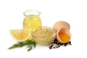Bowl of mustard and ingredients isolated on white background