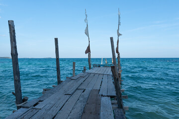 View from a wooden pier on sea with bluesky at loneliness beach