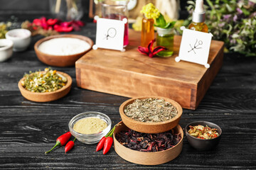 Ingredients for preparing potions on dark wooden background