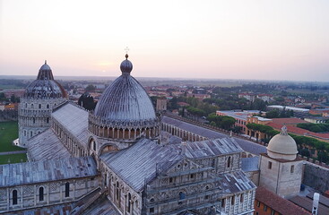 Fototapeta premium View of the cathedral and baptistery of Pisa from the leaning tower at sunset, Tuscany, Italy