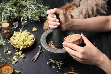 Female alchemist making elixir in laboratory