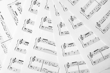 Paper sheets with music notes, closeup