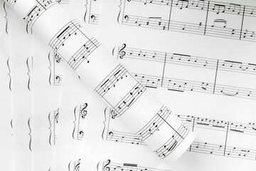 Paper sheets with music notes, closeup