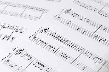 Paper sheets with music notes, closeup