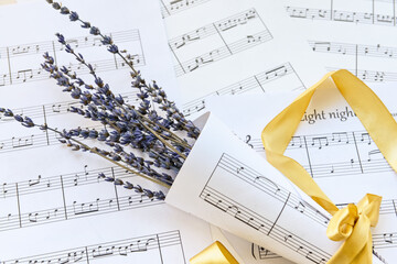 Lavender on paper sheets with music notes