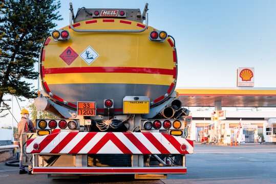 Chiang Mai, Thailand - Dec 15, 2020: Shell Gas Station and Trailer Truck During Sunset. Royal Dutch Shell Oil and Gas Industry Production, Refining, Transport, Marketing, Petrochemical and Trading.