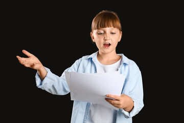 Little actress on dark background
