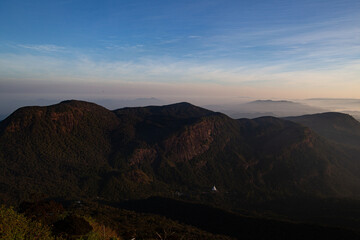 Fototapeta na wymiar Mountain peaks covered with fog in Sri Lanka.