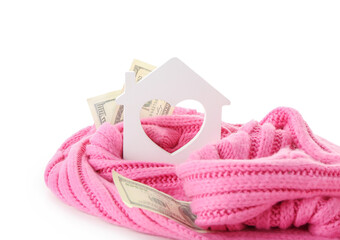 Figure of house, money and warm scarf on white background. Concept of heating season