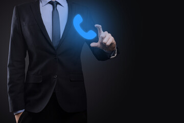 Businessman man in suit on black background hold phone icon.Call Now Business Communication Support Center Customer Service Technology Concept.