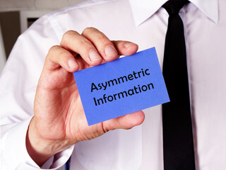 Business concept meaning Asymmetric Information with inscription on the page.