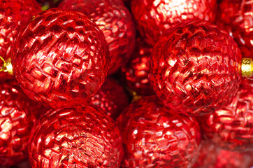 Christmas and New Year decorations. Red sparkling balls close-up. Background. 