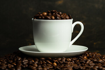 a cup of coffee and a coffee grinder