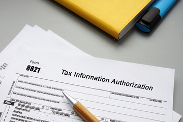 Business concept meaning Form 8821 Tax Information Authorization with sign on the sheet.