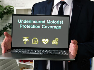  Financial concept meaning Underinsured Motorist Protection Coverage with phrase on the piece of...