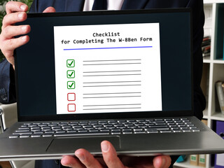  Financial concept about Checklist for Completing The W-8Ben Form with sign on the sheet.