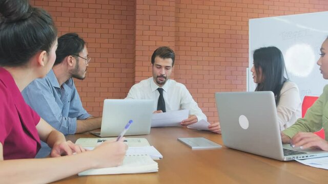 Group of interacial business people meeting in the offfice of company.