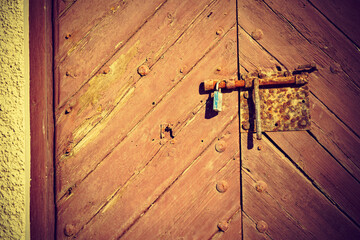 Old wooden door with rustic lock