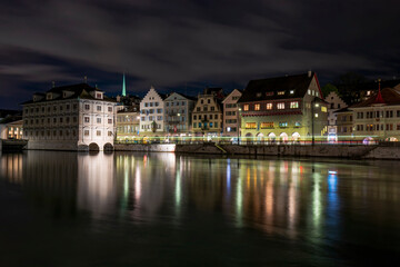 Fototapeta na wymiar Picturesque night view of town hall and historical buildings on Limmat river quay, Zurich, Switzerland