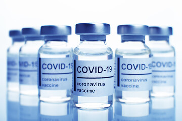 Glass sealed vials with coronavirus vaccine text on label