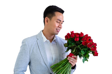 Asian man wearing grey suit holding a bouquet of red roses isolated in white background for anniversary or Valentine's day concept.