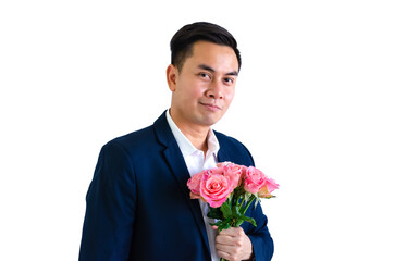 Asian man wearing navy blue suit holding a bouquet of pink roses isolated in white background for anniversary or Valentine's day concept.