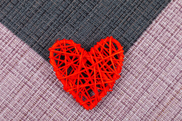 Two red hearts on a black and pink background. Valentine's Day.