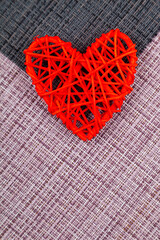 Two red hearts on a black and pink background. Valentine's Day.