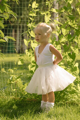 Little girl ballerina in the garden