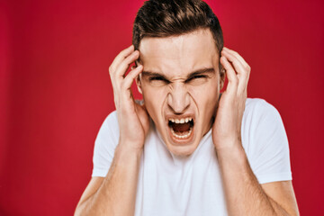 Man in white t-shirt emotions displeased facial expression isolated background