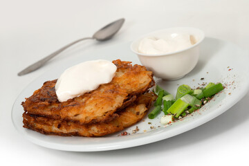 Fried potato pancakes on the white background