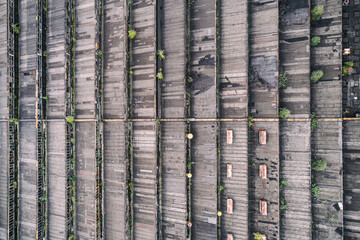 Old roof at the factory with widnows aerial drone photo
