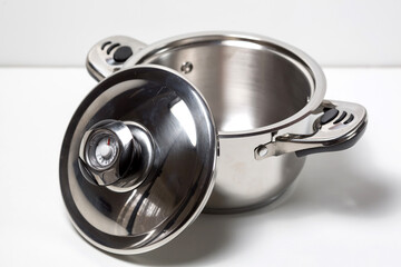 Close-up stainless steel pan, isolated on white background.