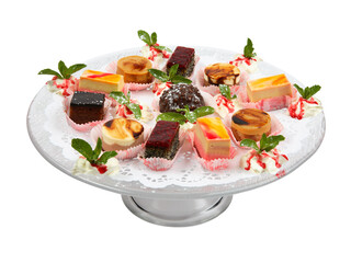 Assortment of pieces of cake on glass plate