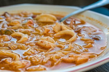 Seafood soup. Formed by noodles and the broth from the cooking of different seafood.