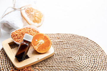 Spa composition with natural orange oil in a jar copy space.